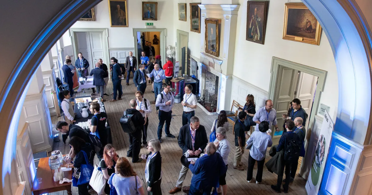 A photo showing people networking at a previous SDSC event.