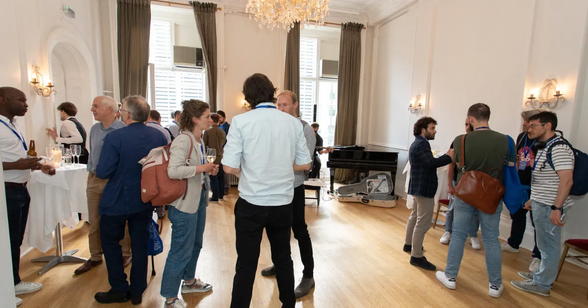 A photo of people networking at a previous SDSC after party.